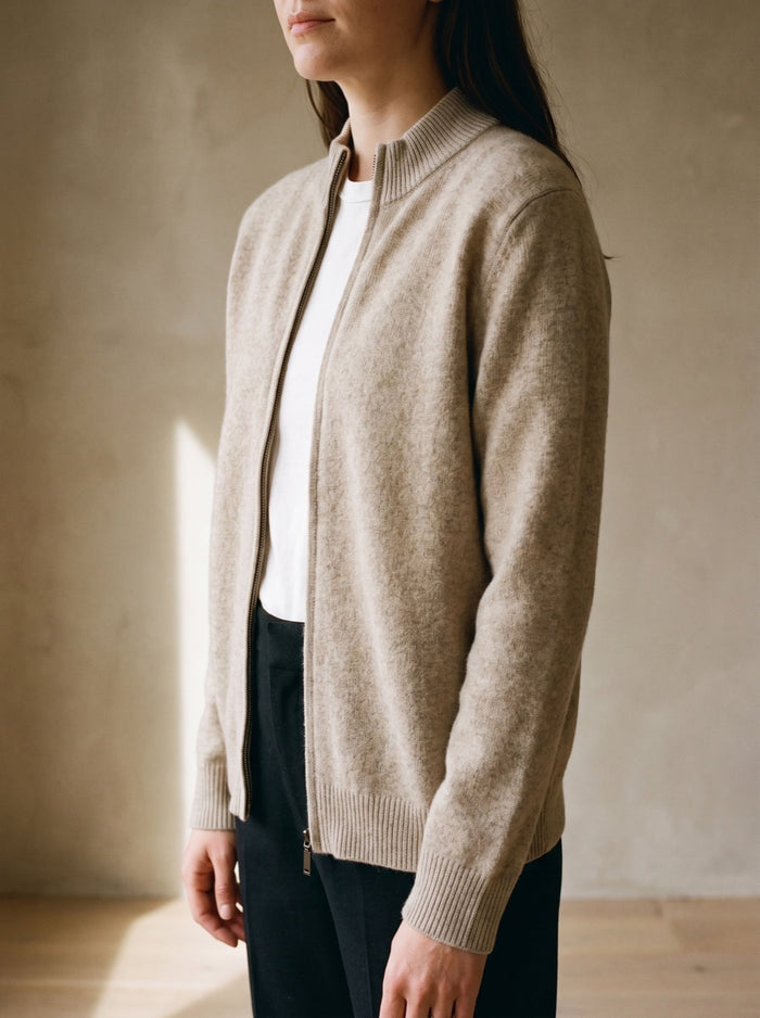 A beige cardigan, worn