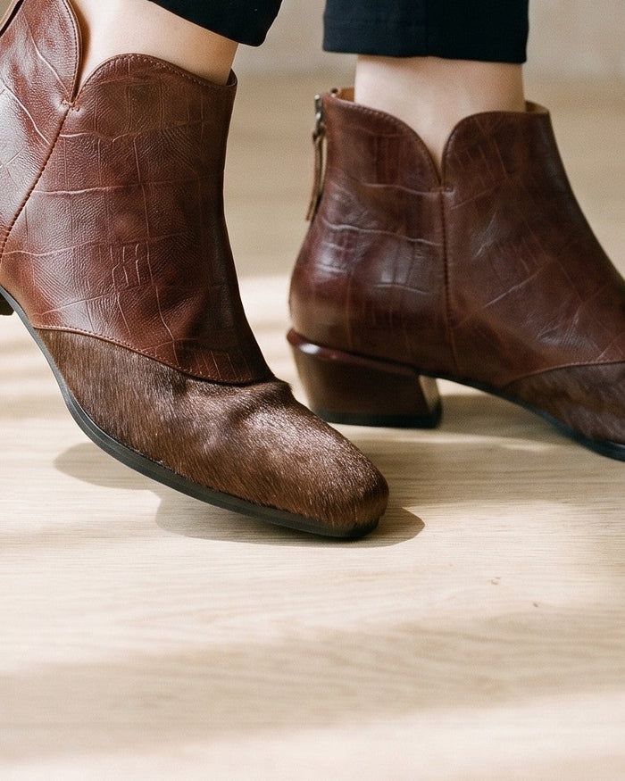 Brown leather ankle boots, worn