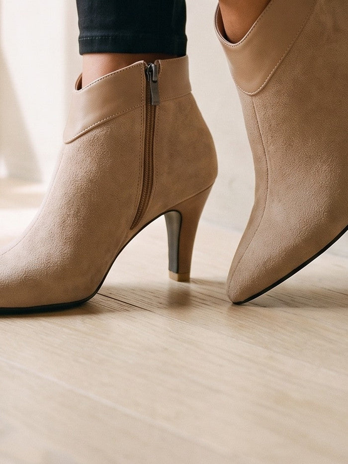 The Cordelia Ankle Boot in Beige — the shoe close, worn