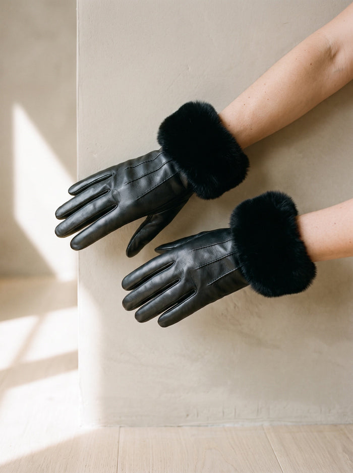 The Gwen Glove in Black, worn on both hands, held at waist height