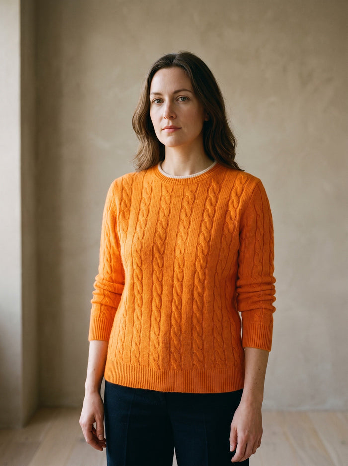 The Perdita Jumper in Orange, worn — front view