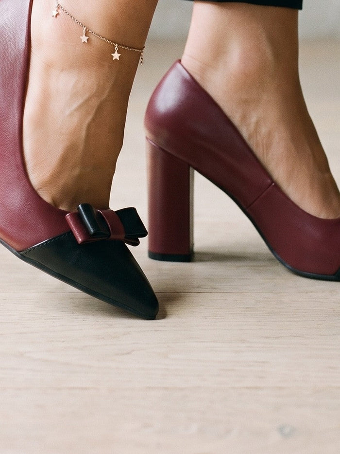The Constance Pump in Burgundy — the shoe close, worn