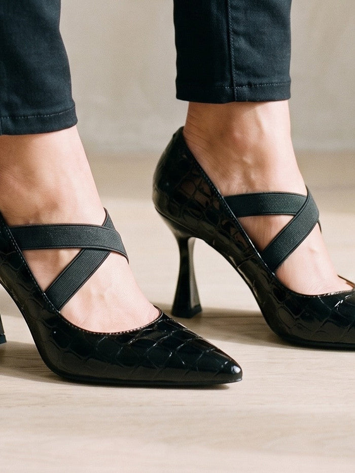 The Delphine Heel in Black — the shoe close, worn