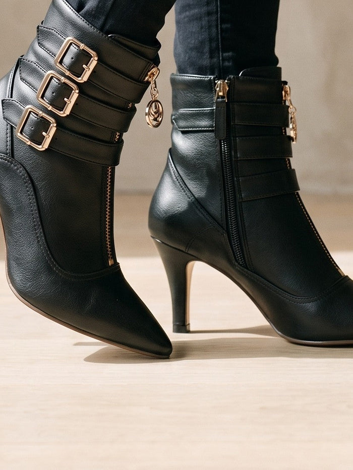 The Frankie Boot in Black — the shoe close, worn