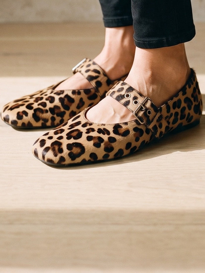 The Imogen Flat in Tan Leopard — the shoe close, worn