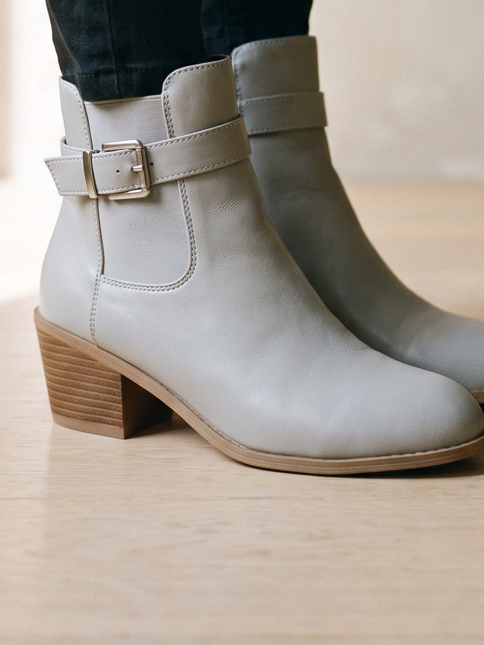 The Simone Boot in Grey — the shoe close, worn