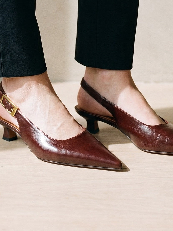 The Sorrel Pump in Wine Red — the shoe close, worn