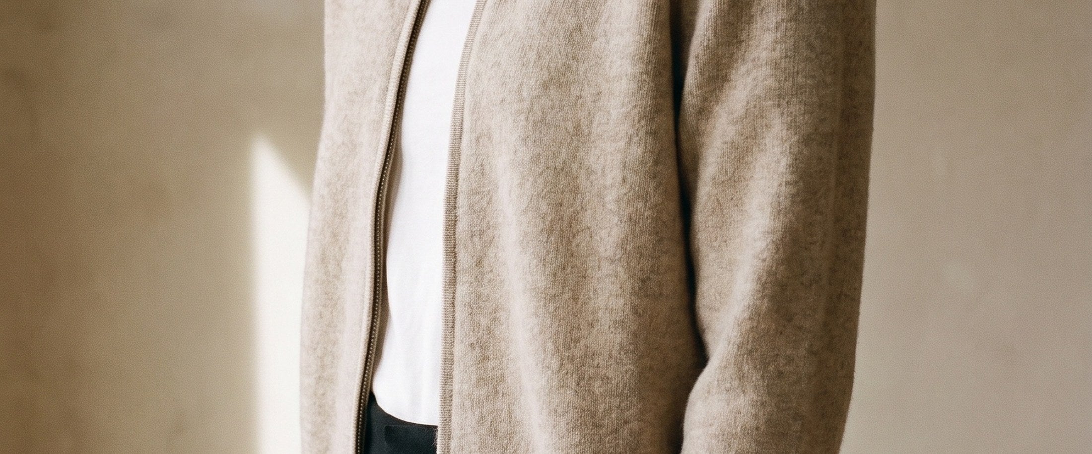 A beige cardigan, worn